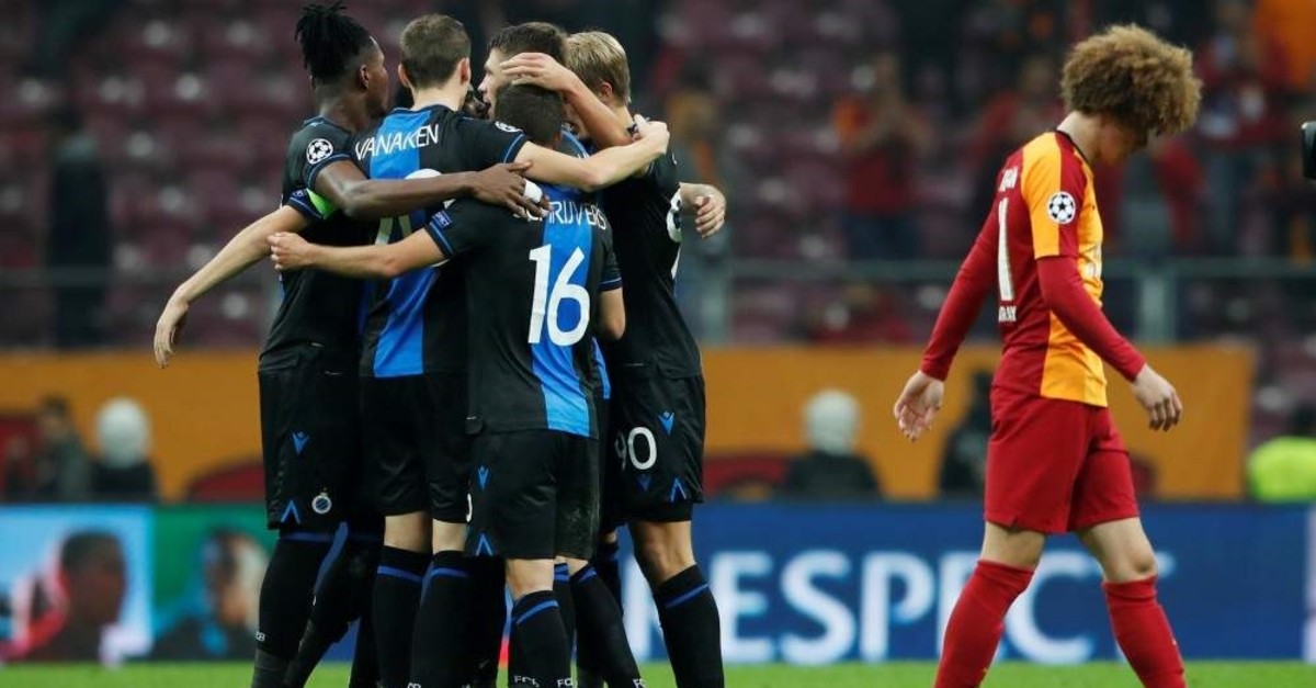 Club Brugge players celebrate after the match while Galatasaray's Erencan Yardu0131mcu0131 walks away, Istanbul, Nov. 26, 2019. (Reuters Photo)