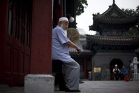 A Chinese Muslim man waits for the time to break his fast during the Muslim holy month of Ramadan at the Niujie mosque, the oldest and largest mosque in Beijing, China, July 2, 2014. (AP Photo)