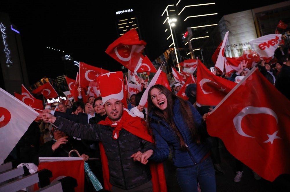 Supporters of the 'yes' camp celebrate as the results of the constitutional referendum are announced in Ankara, April 16.