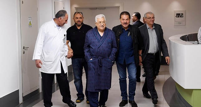 Palestinian President Mahmoud Abbas walks inside the hospital in Ramallah, in the occupied West Bank May 21, 2018. (Reuters Photo)