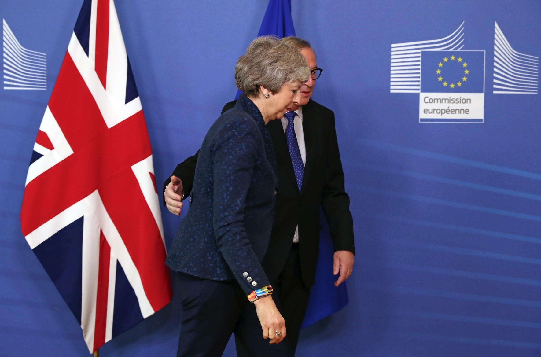 European Commission President Jean-Claude Juncker (L) arrives with British Prime Minister Theresa May before their meeting at the European Commission headquarters in Brussels, Thursday, Feb. 7, 2019. 