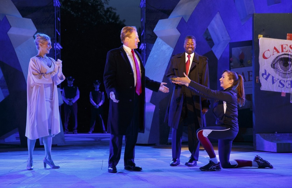 Tina Benko, left, portrays Melania Trump in the role of Caesaru2019s wife, Calpurnia, and Gregg Henry, center left, portrays President Donald Trump in the role of Julius Caesar during a dress rehearsal.