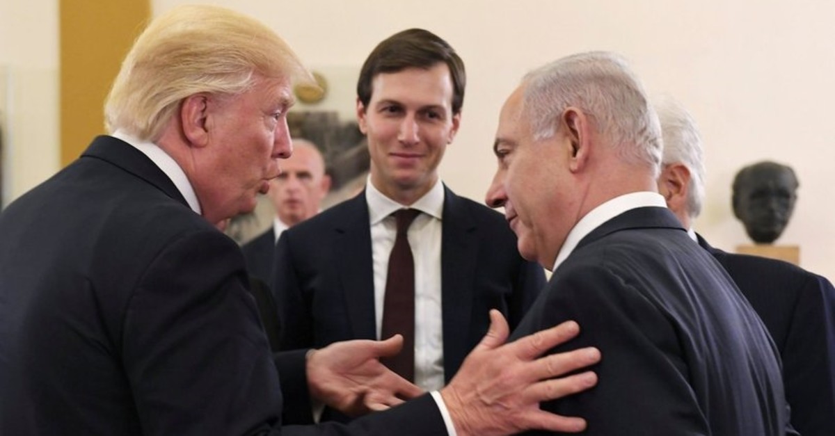 White House senior adviser Jared Kushner (C) listens as U.S. President Donald Trump (L) talks with Israeli Prime Minister Benjamin Netanyahu at the King David Hotel in Jerusalem May 22, 2017. 
