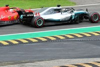 Mercedesu2019 British driver Lewis Hamilton (front) and Ferrariu2019s German driver Sebastian Vettel crash during the Italian Formula One Grand Prix at the Autodromo Nazionale circuit in Monza, Sept. 2.