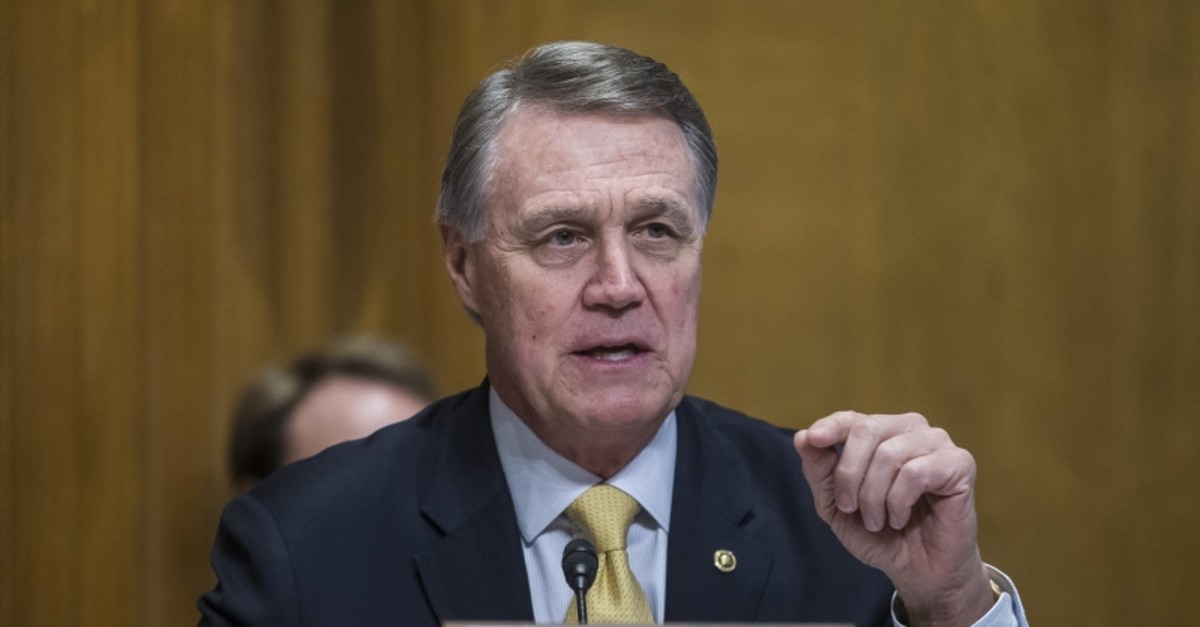  In this file photo Sen. David Perdue (R-GA) questions US Secretary of State Mike Pompeo during a Senate Caucus on International Narcotics Control hearing on June 11, 2019 in Washington, DC. (AFP Photo)