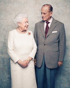 A handout photo shows Britain's Queen Elizabeth and Prince Philip in the White Drawing Room at Windsor Castle in early November, pictured against a platinum-textured backdrop, in celebration of their platinum wedding anniversary on November 20, 2017. (Matt Holyoak/CameraPress/PA Wire/Handout via Reuters)