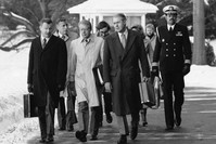 Former U.S. President Jimmy Carter, flanked by Secretary of State Cyrus Roberts Vance, (R) and his adviser on foreign policy,  Zbigniew Brzezinski (L) walking toward a waiting helicopter to fly to the nearby Andrews Air Force Base, Feb. 14, 1979. 