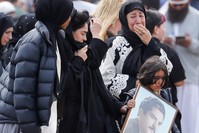 Mourners arrive for the burial service of one of the victims from the March 15 terrorist attack, at the Memorial Park Cemetery in Christchurch, March 21, 2019.