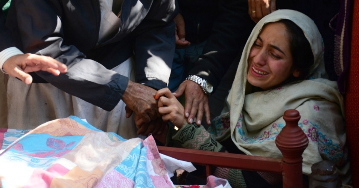 A woman mourns the death of her relative, who, according to the family, was killed in shelling, during a funeral in Nauseri village, near line of control in Pakistan-administered Kashmir, Oct. 20, 2019. (Reuters Photo)