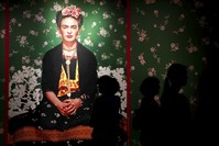 Visitors attend the u201cFrida Kahlo: Masterpieces from the Museo Dolores Olmedo, Mexico Cityu201d exhibition at the Hungarian National Gallery in Budapest.