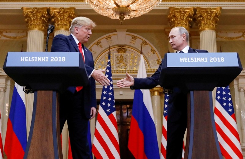 U.S. President Donald Trump and Russian President Vladimir Putin shake hands during a joint news conference after their meeting in Helsinki, Finland, July 16, 2018. (Reuters Photo)