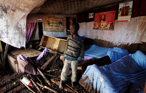 A child walks in his house, which was partly destroyed by flooding water after a dam burst, in Solio town near Nakuru, Kenya May 10, 2018. (REUTERS Photo)