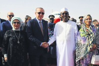 President Erdou011fan was welcomed by Chadian President Idriss Deby at the N'Djamena Airport, N'Djamena, Dec. 26.