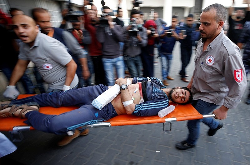 A Palestinian, who was wounded at the Israel-Gaza border, is carried into a hospital in Gaza City, April 27, 2018. (Reuters Photo)