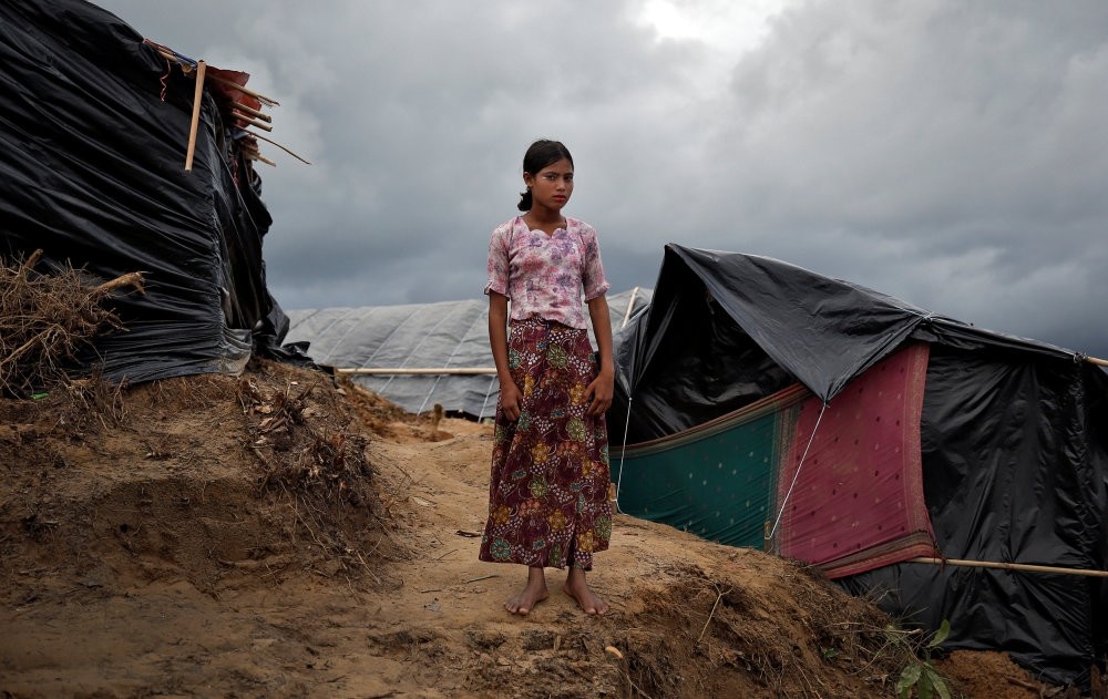 A Rohingya refugee girl poses for a picture in Cox's Bazar, Bangladesh, Sept. 28. 