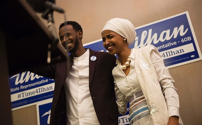 Ilhan Omar, candidate for State Representative for District 60B in Minnesota, with her husband Ahmed Hirisi, arrives for her victort party on election night, November 8, 2016 in Minneapolis, Minnesota. (AFP Photo)