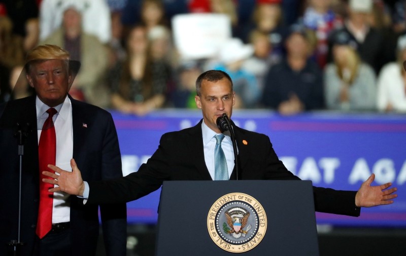 In this April 28, 2018 file photo, President Donald Trump, left, watches as Corey Lewandowski, right, his former campaign manager for Trump's presidential campaign, speaks during a campaign rally in Washington Township, Mich. (AP Photo)