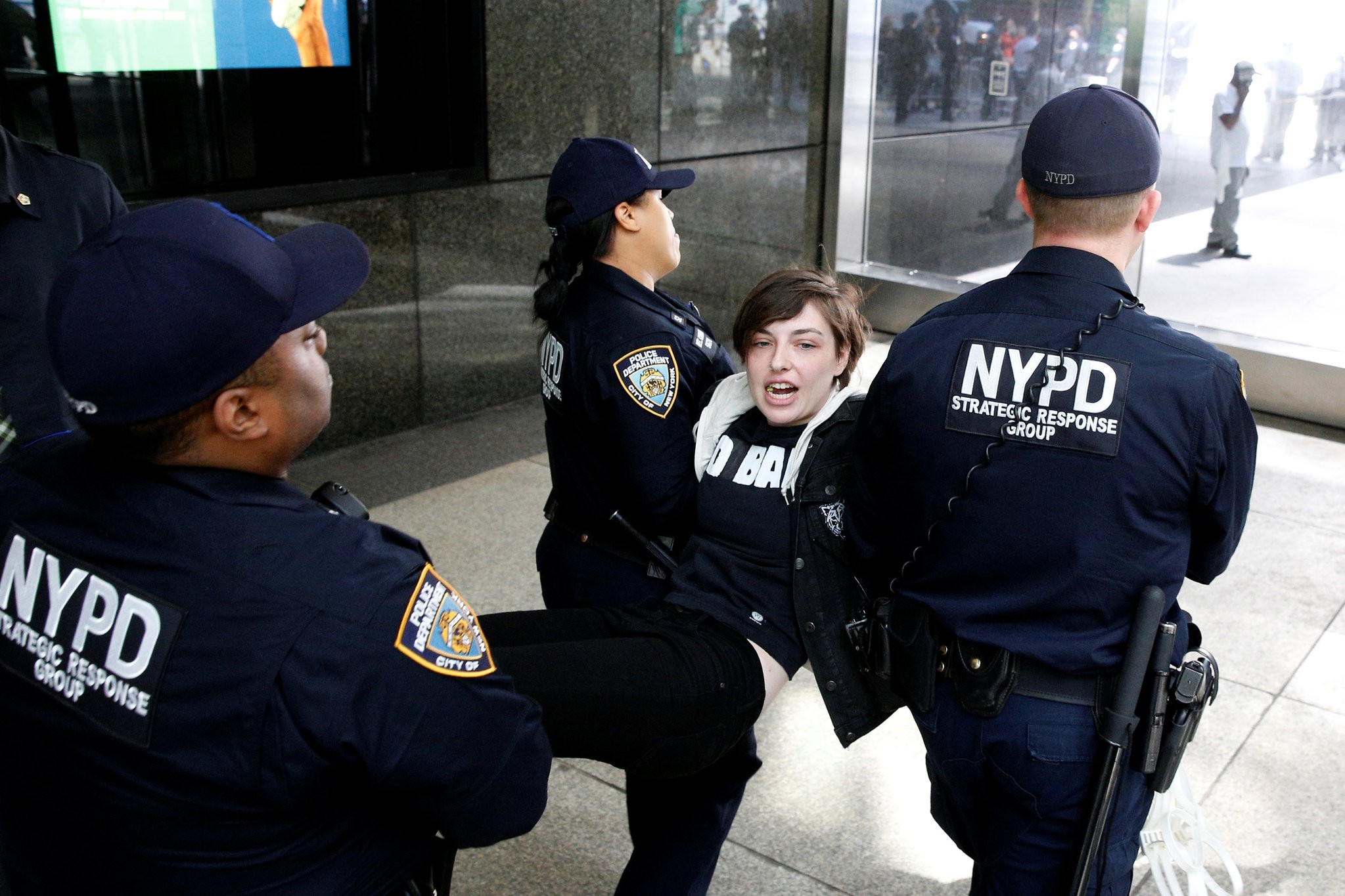 New York City Police officers (NYPD) carry a protestor after making arrests for demonstrating in Trump Tower in New York City, U.S., April 13, 2017. (Reuters Photo)