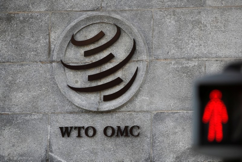 A logo is pictured outside the World Trade Organization (WTO) headquarters next to a red traffic light in Geneva, Switzerland, October 2, 2018. (Reuters Photo)