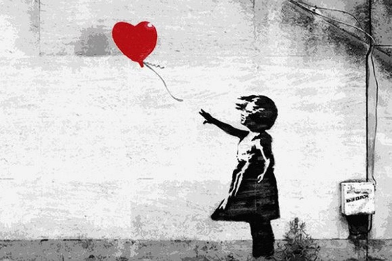 Banksy has garnered global attention with the striking themes of his unique street art created on walls in various countries. (FILE Photo)