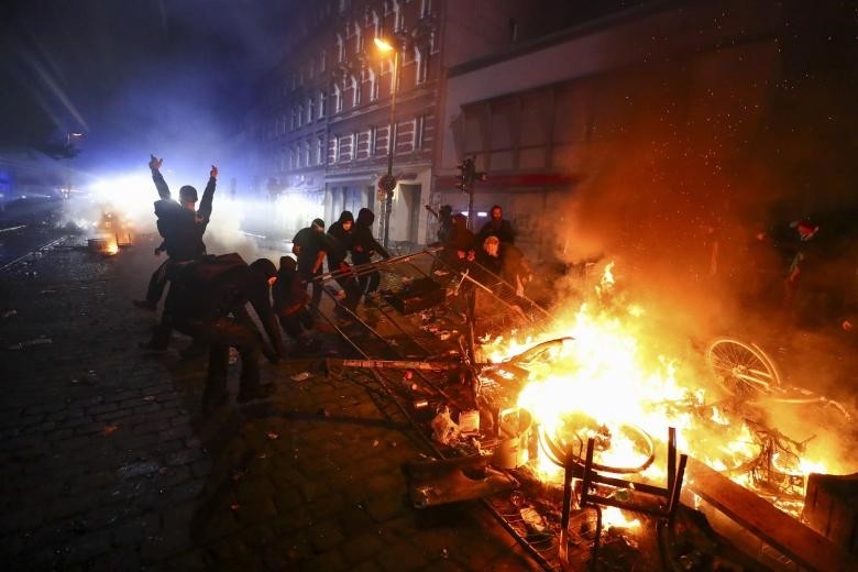 Private and public property burns as protesters clash with riot police during the protests at the  G20 summit in Hamburg, Germany, July 7