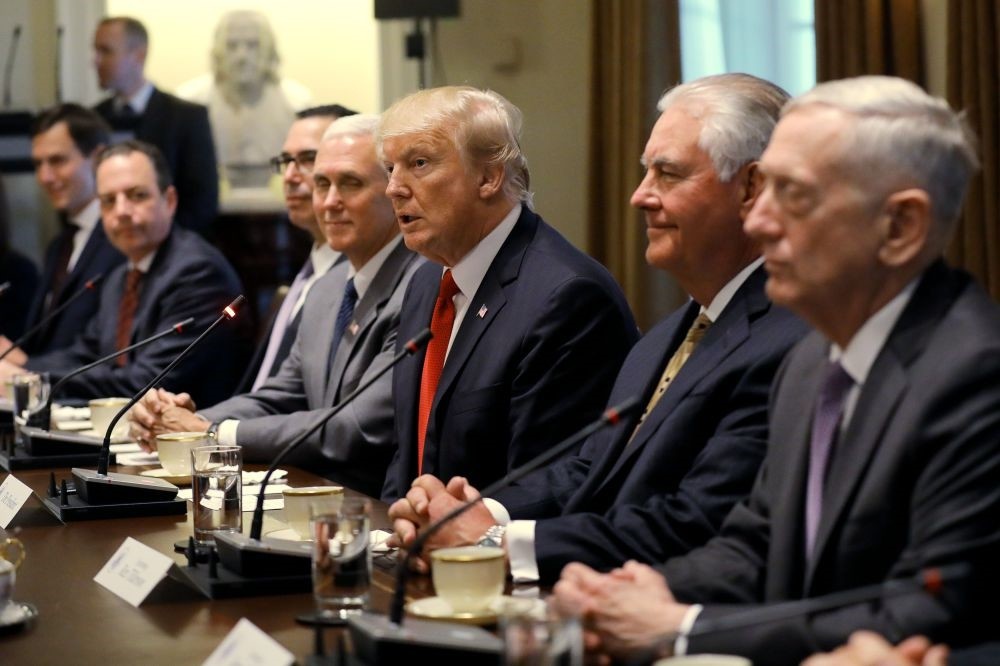 Trump, flanked by (L-R) Kushner, Priebus, Mnuchin, VP Mike Pence, Secretary of State Tillerson (2nd R) and Secretary of Defense Mattis (C), speaks at a meeting with Indian Prime Minister Narendra Modi in the Cabinet Room of the White House, June 26. 