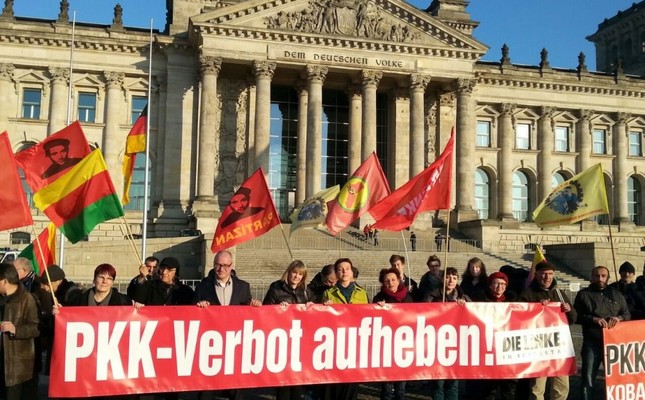 Pro-PKK supporters seen holding a banner that reads Lift the PKK ban during a demonstration in front of the Reichstag building in Berlin to show solidarity with the terrorist group