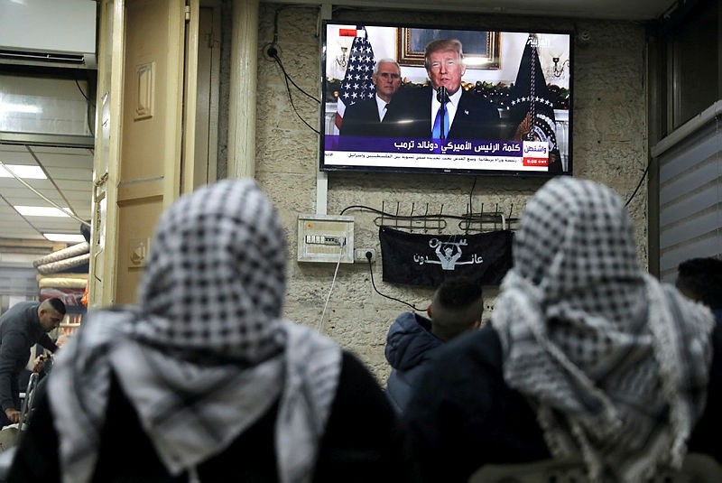 Palestinians watch a televised broadcast of U.S. President Donald Trump delivering an address where he announced that the United States recognises Jerusalem as the capital of Israel, in Jerusalem's Old City, Dec. 6, 2017. (Reuters Photo)