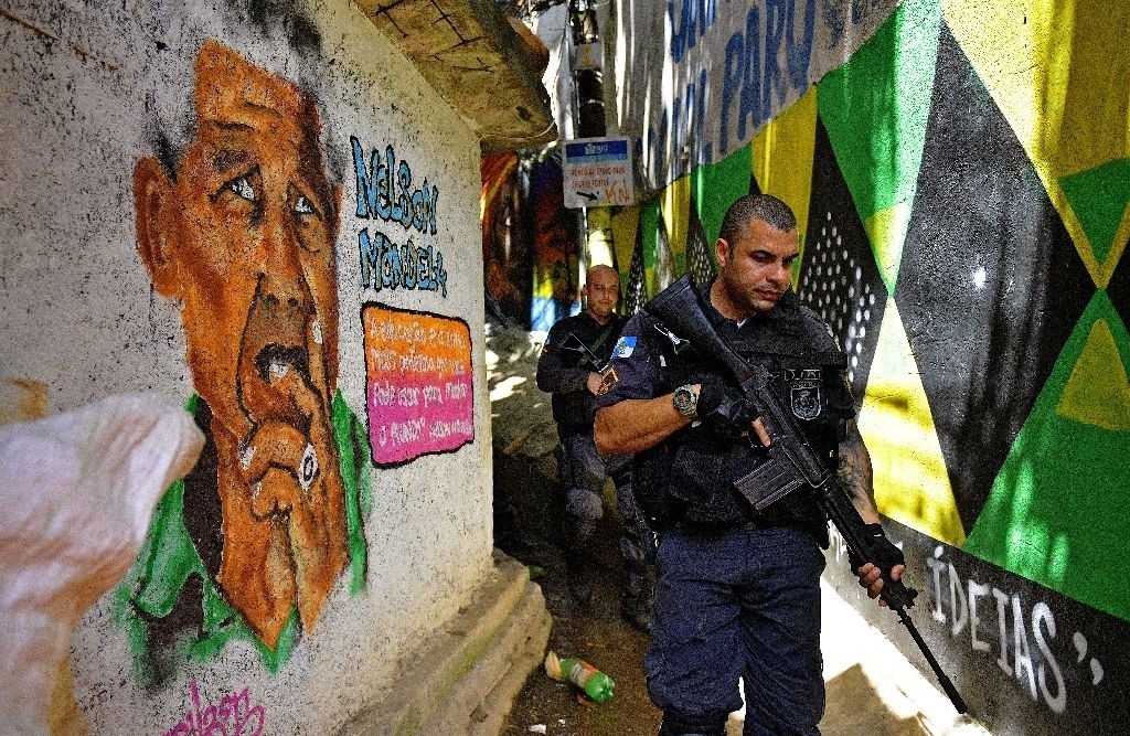Brazilian police like these on patrol in September have had trouble controlling crime in Rio de Janeiro's vast Rocinha favela. (AFP Photo)