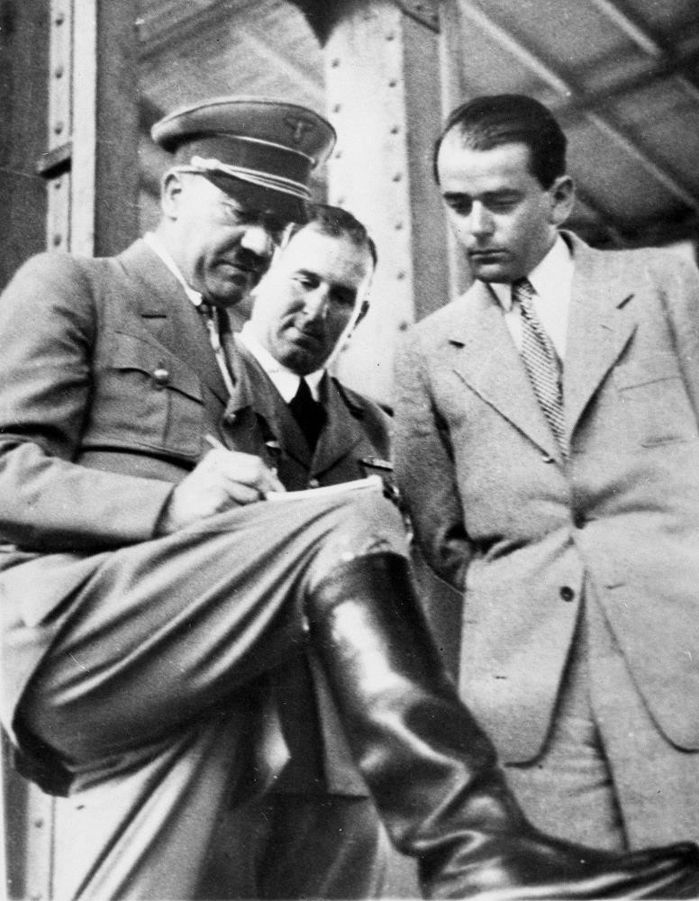 Adolf Hitler, (L), discusses plans for building a convention hall at Nuremberg with Lord Mayor Willy Liebel, (C), and Professor Albert Speer, (R), at Nuremberg, Germany.  