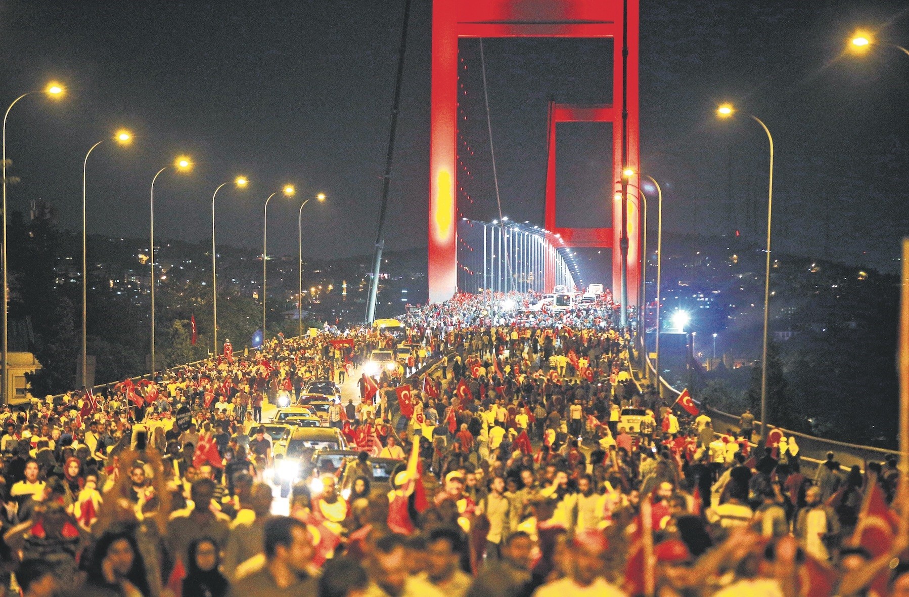 People protest against the July 15 coup attempt on Istanbul's Bosporus Bridge, July 21, 2016. 