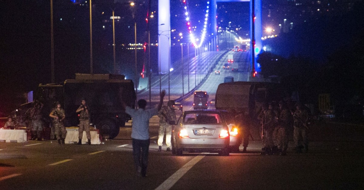 A man approaches putschist soldiers who closed down the Bosporus bridge with his hands, July 16, 2016. Putschists killed 251 people during the coup attempt.