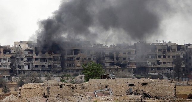 صورة لمخيم اليرموك تحت القصف الأسدي الفرنسية