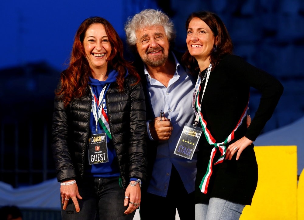 Beppe Grillo (C), the founder of the anti-establishment 5-Star Movement, is seen with party members during a march in opposition to the constitutional reform referendum in Rome.