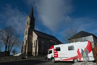 A mobile office bus of the savings bank Sparkasse parked in Tschirn, Germany.