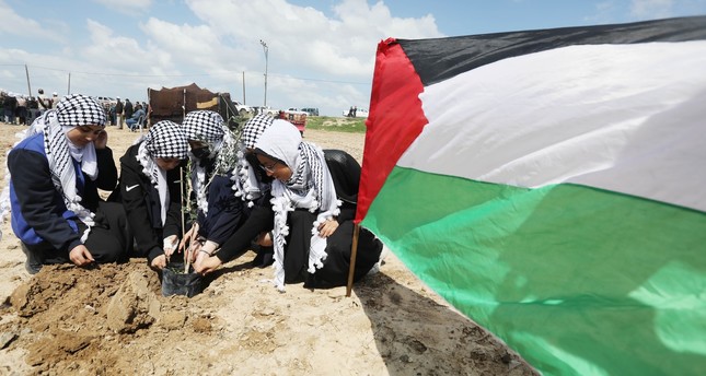 فلسطينيون في قطاع غزة ينظمون فعاليات في الذكرى 47 لـيوم الأرض الوطني، 30-3-2023 الأناضول