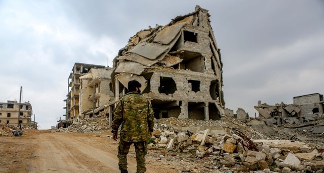 Apartment buildings destroyed in Syria's civil war seen on the outskirts of Aleppo. (Sabah File Photo)
