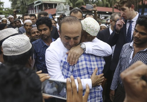 Foreign Minister Çavuşoğlu, centre, meets Rohingya Muslims at the Kutupalong refugee camp near Cox's Bazar's Teknaf area, Bangladesh, Sept. 7, 2017. (AA Photo)