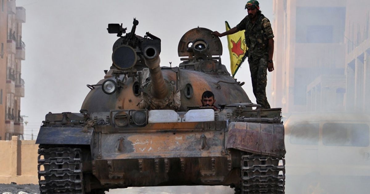 File photo shows YPG militants in a tank. 