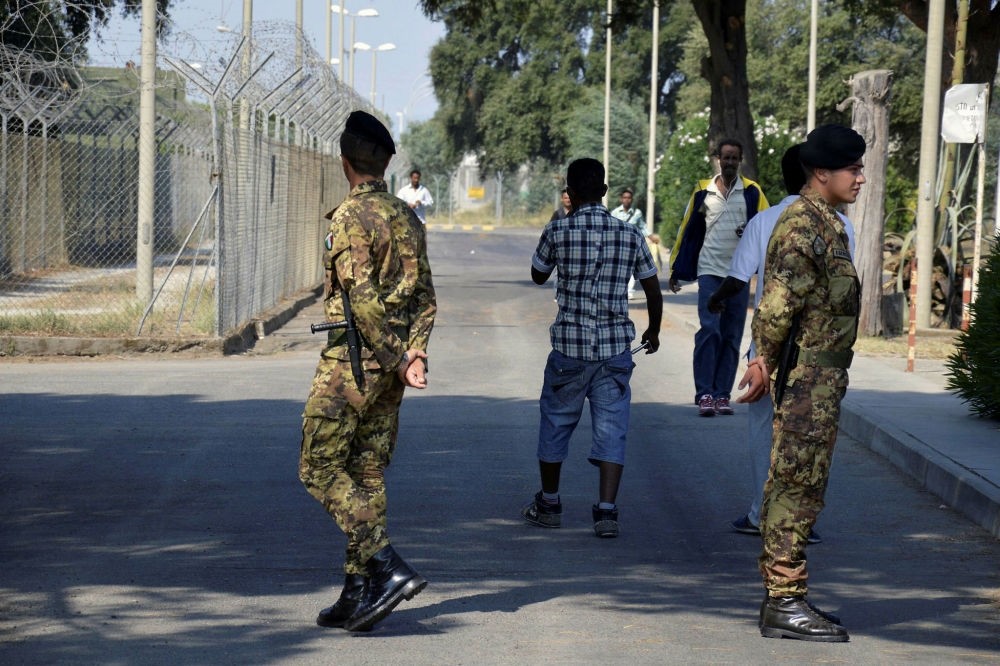 Soldiers patrol the Isola di Capo Rizzuto, the country's biggest migrant welcome center, near Crotone, southern Italy.