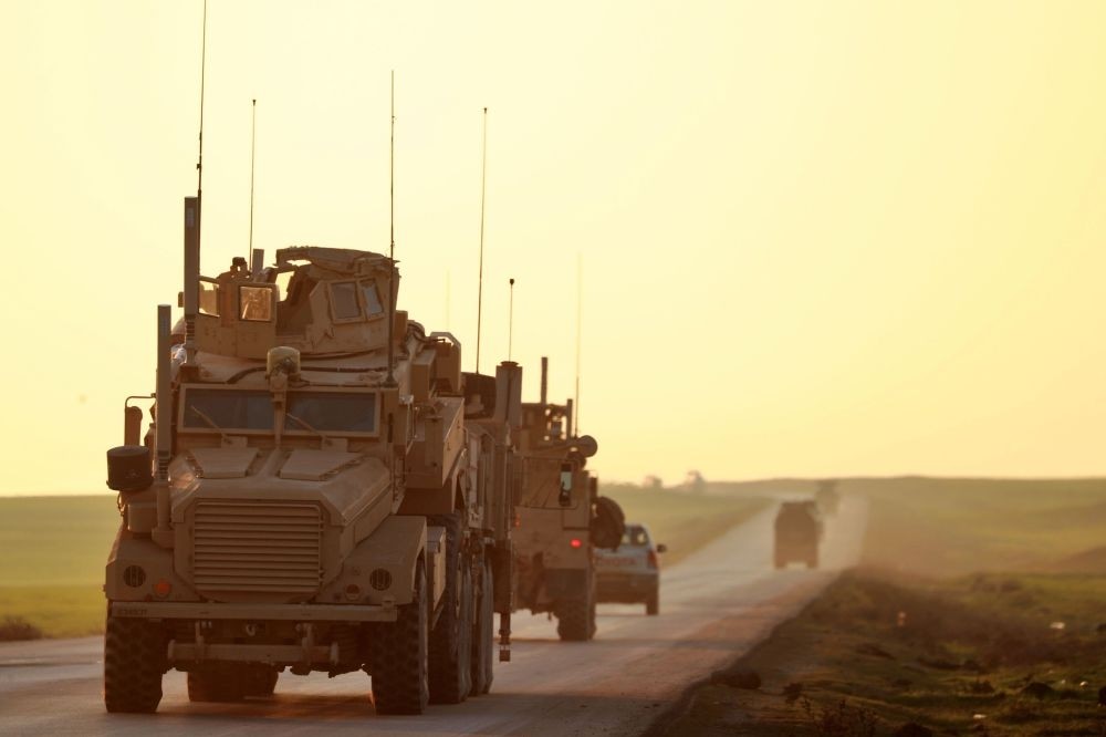 U.S. Marine Corps tactical vehicles are seen driving along a road near the town of Tal Baydar in the countryside of Syria's northeastern Hasakeh province, Dec. 21.