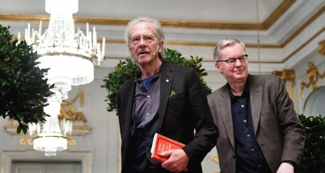 Peter Handke speaks at a press conference at the Swedish Academy in Stockholm, Friday, Dec. 6, 2019. (TT News Agency via AP)