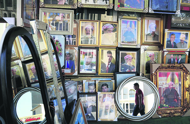 Portraits of KRG leader Masoud Barzani seen hanging in a store in Irbil, the capital of the autonomous Kurdish region of northern Iraq, June 8 (AFP Photo).