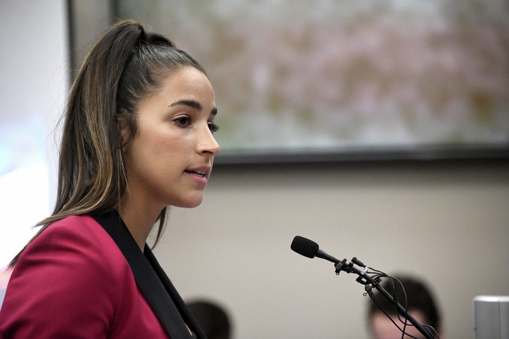 In this Jan. 19, 2018, file photo, Olympic gold medalist Aly Raisman gives her victim impact statement in Lansing, Mich., during the fourth day of sentencing for former sports doctor Larry Nassar. (AP Photo)