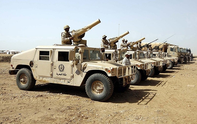 Saudi soldiers atop military vehicles line up for inspection during the arrival of Saudi Prince Khaled bin Sultan bin Abdul-Aziz, assistant minister for defence and aviation, in Jazan near the border with Yemen Nov. 10, 2009. (Reuters Photo)