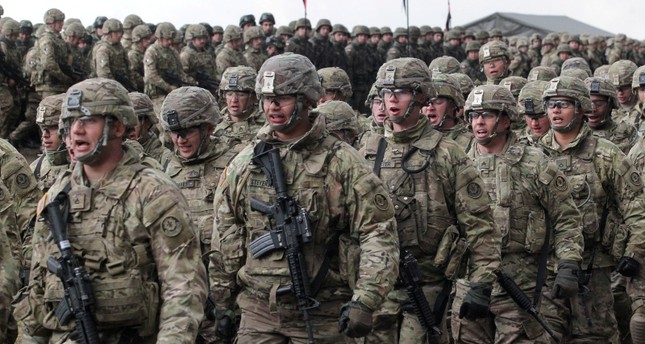 Soldiers of the 2nd Armored Cavalry Regiment of the US Army during welcome ceremony of the NATO Enhanced Forward Presence (eFP) contingent in the Military Training Center of the Land Forces in Orzysz, northern Poland, April 13, 2017. (EPA Photo)
