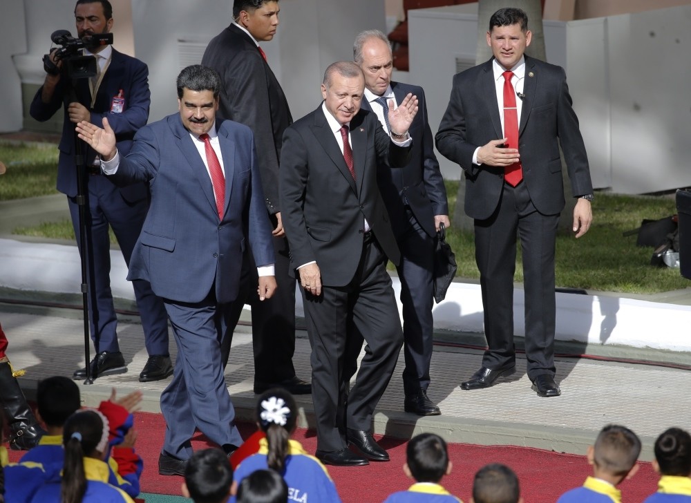 President Recep Tayyip Erdou011fan and Venezuelau2019s President Nicolas Maduro wave at children at the Miraflores Presidential Palace in Caracas, Venezuela, Dec. 3.