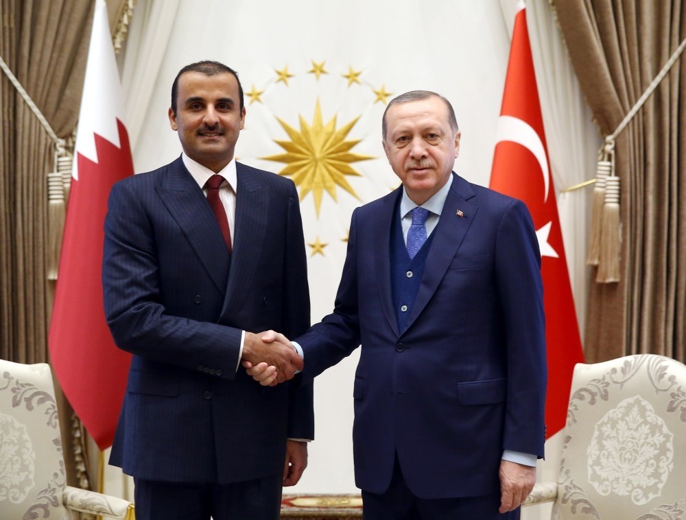 Emir of Qatar Sheikh Tamim bin Hamad Al Thani (L) shakes hands with President Recep Tayyip Erdou011fan, Ankara, Jan.15.