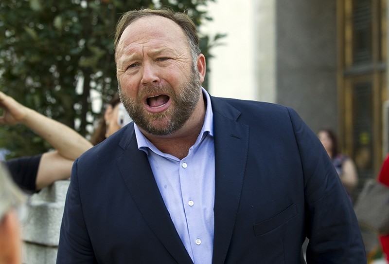 In this Sept. 5, 2018, file photo conspiracy theorist Alex Jones speaks outside of the Dirksen building of Capitol Hill. (AP Photo)