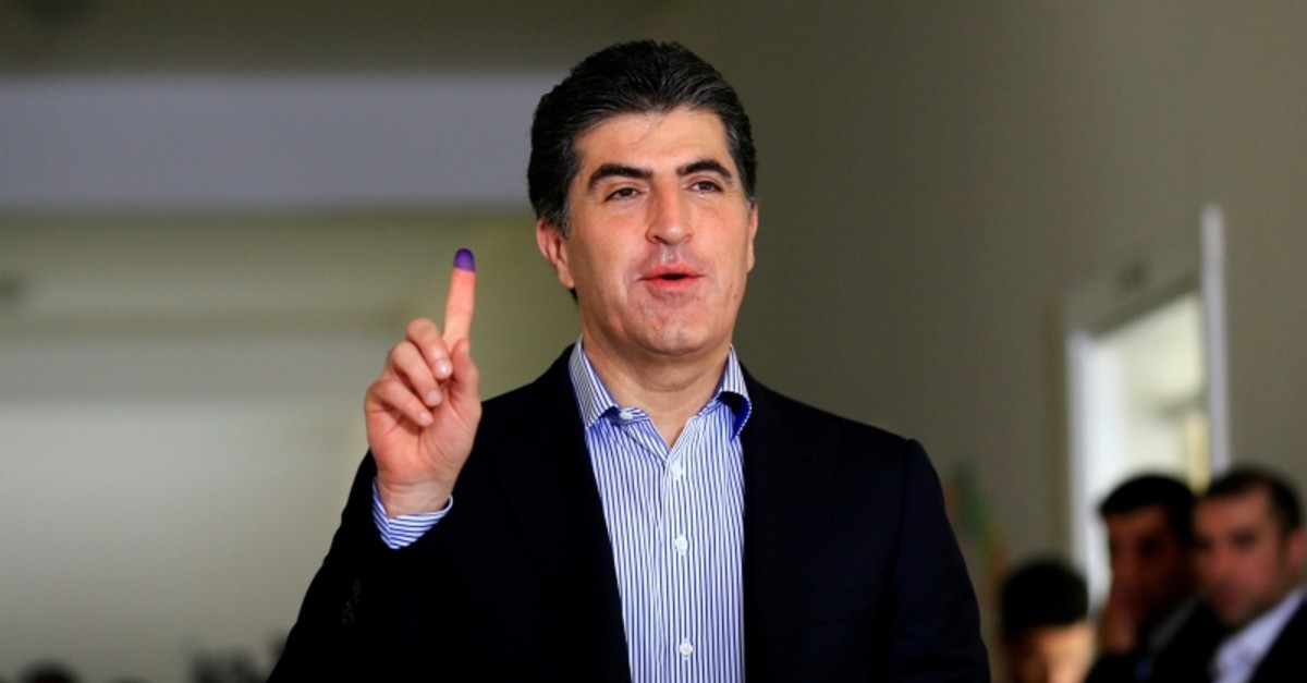 Nechirvan Barzani shows his ink-stained finger after casting his vote at a polling station during KRG parliamentary elections in Irbil, Iraq, Sept. 30, 2018. (Reuters Photo